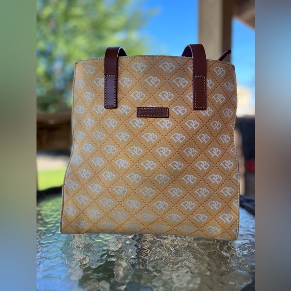 Dooney & Bourke Handbags - Dooney & Bourke North South signature print yellow canvas shoulder bag